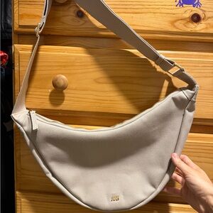 Minimal Crescent Shoulder Bag in Beige with Subtle Logo